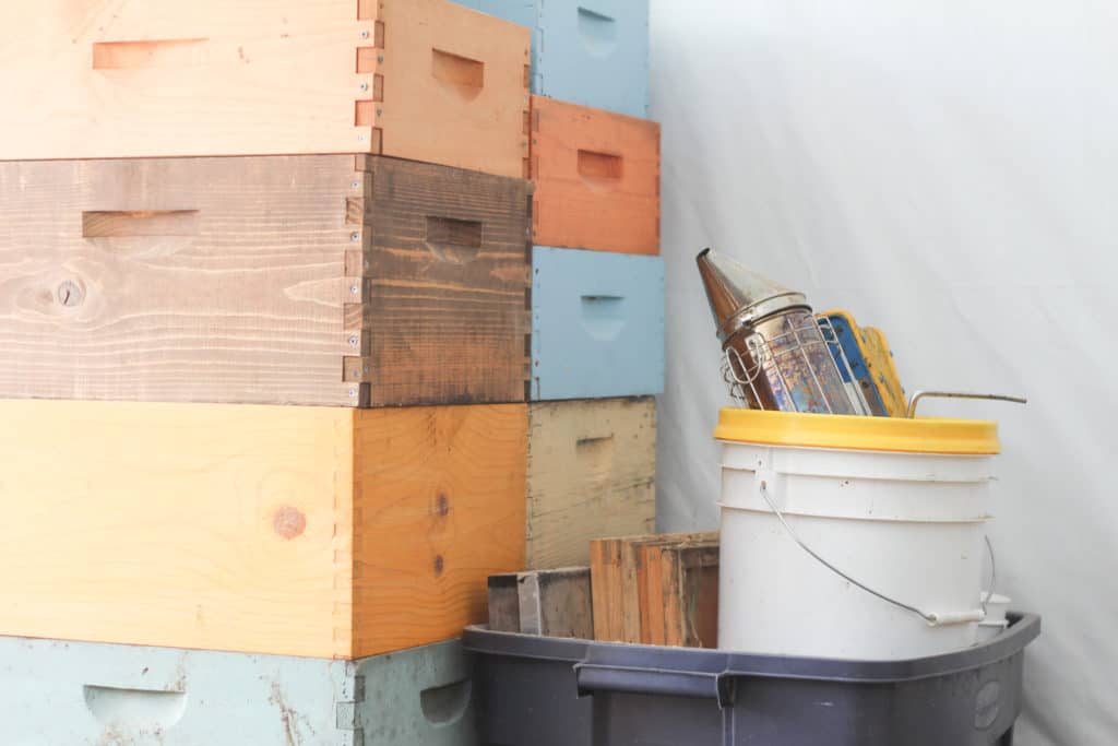 stack of bee hive boxes, beekeeping supplies for beginners