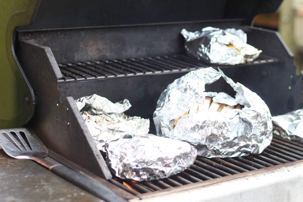 Foil packets of salmon on the grill