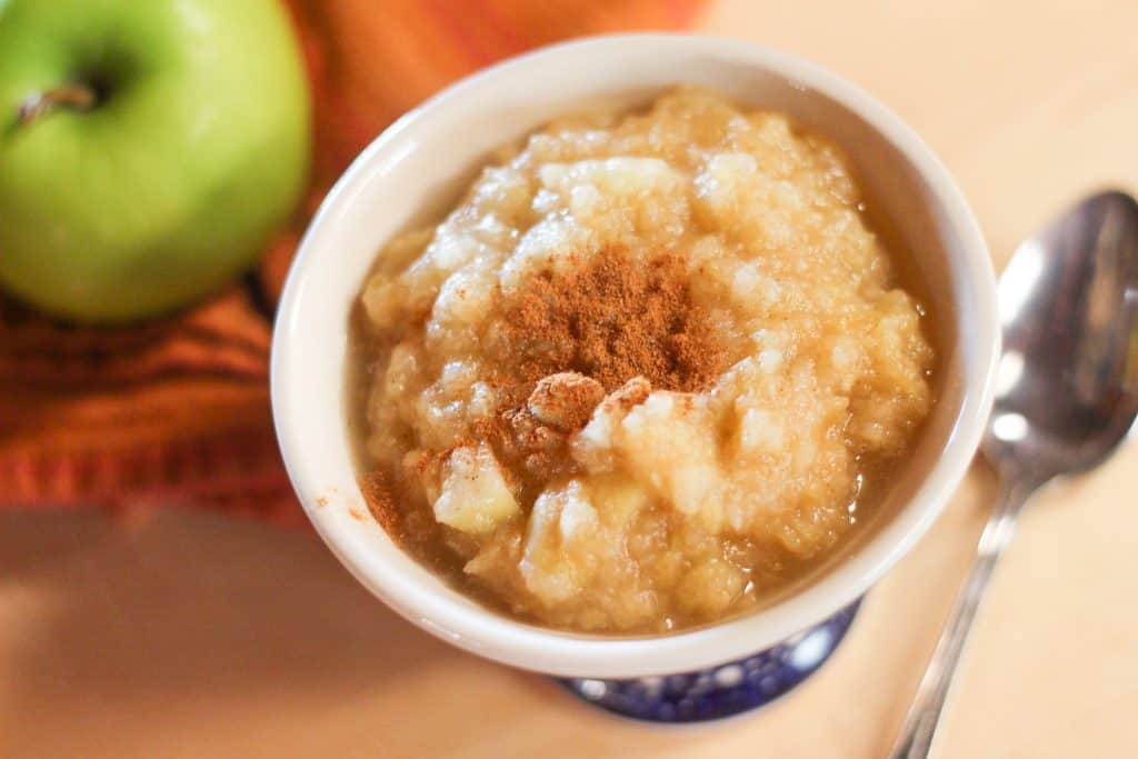 A small dish with applesauce.