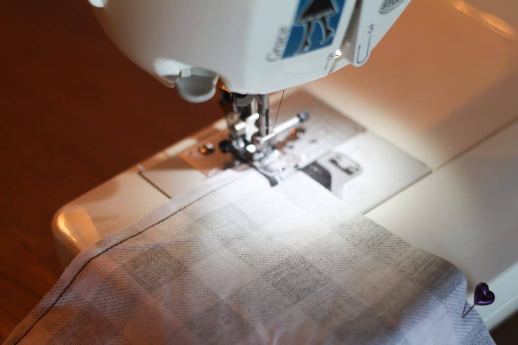A sewing machine sewing fabric for DIY reversible cloth napkins