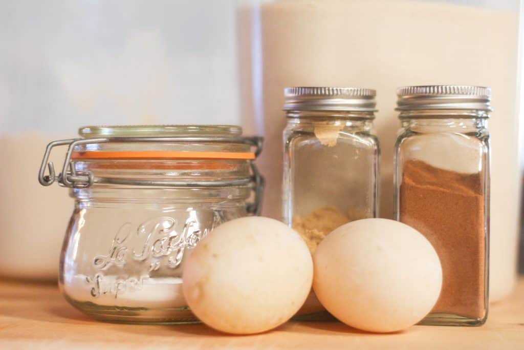 Eggs and spice bottles for cookie ingredients