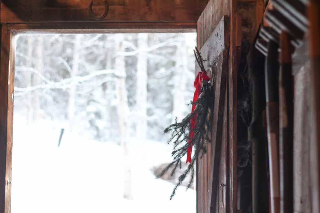 opened barn door with Christmas decoration