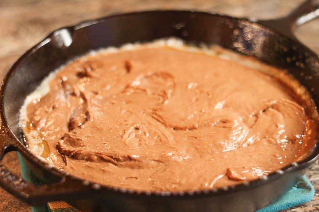 cake batter in a cast iron
