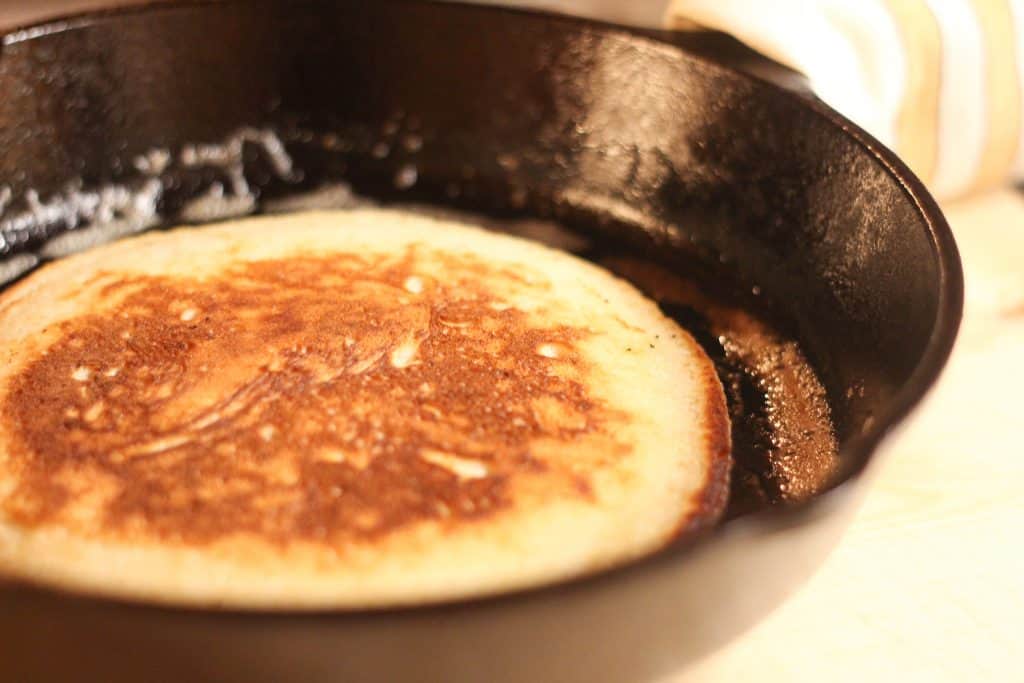 pancake cooking in cast iron