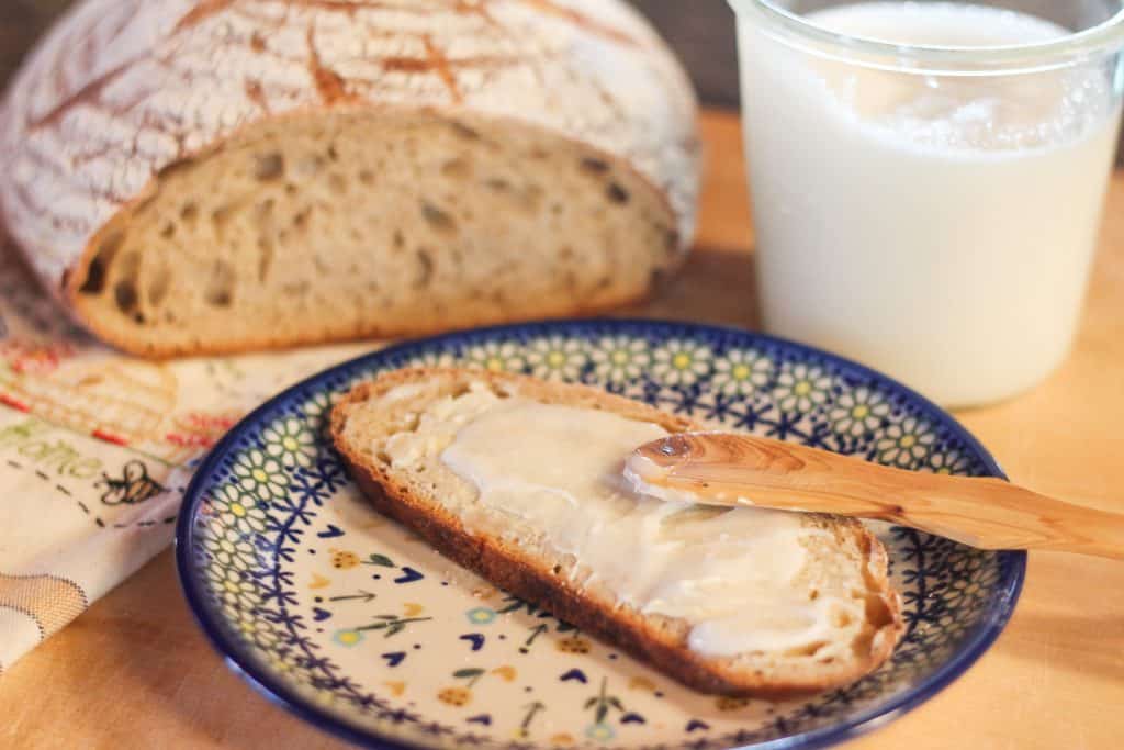 A loaf of sourdough bread on a cutting board