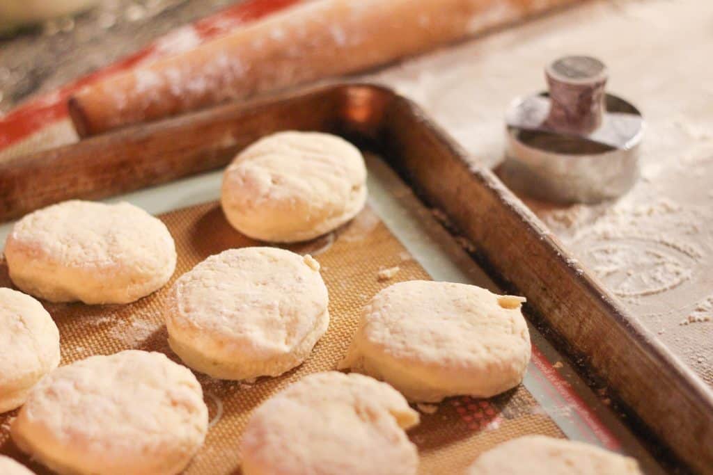 Uncooked biscuits on a cookie sheet