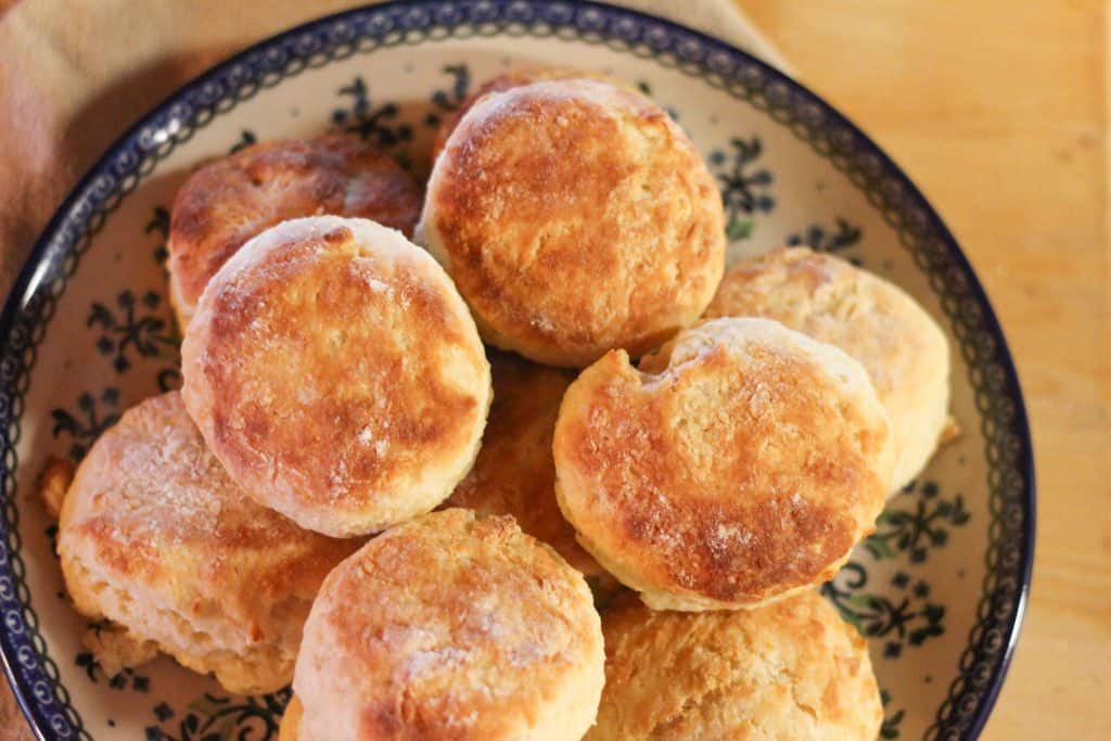 A plate of sourdough biscuits stacked on it
