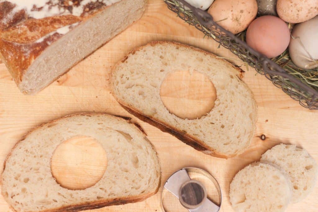 Slices of bread with holes cut out of the center