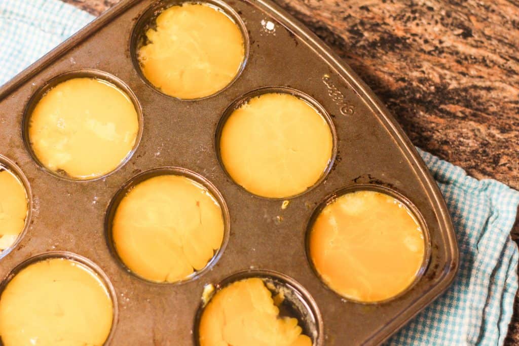 Eggs in a muffin tin to be frozen to use later