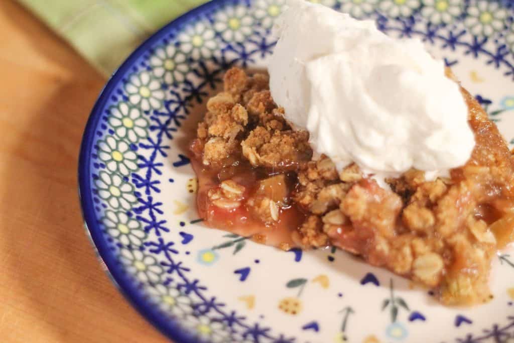 Oatmeal rhubarb crunch topped with whipped cream