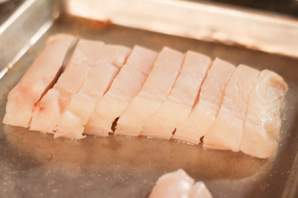 A halibut fillet cut into strips
