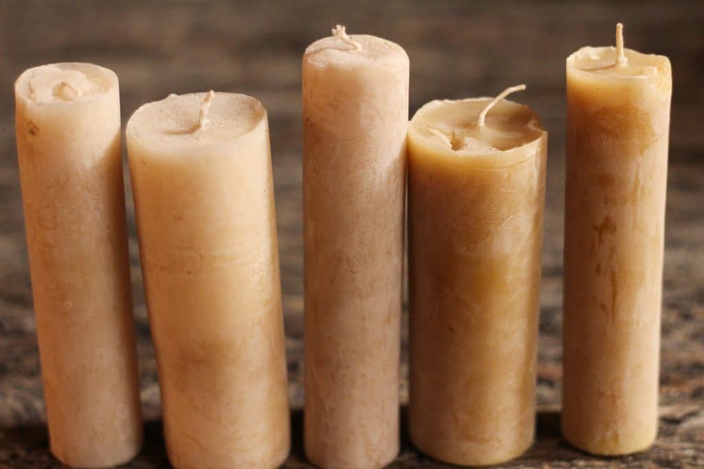 5 pillar beeswax candles in a row, benefits of beeswax candles