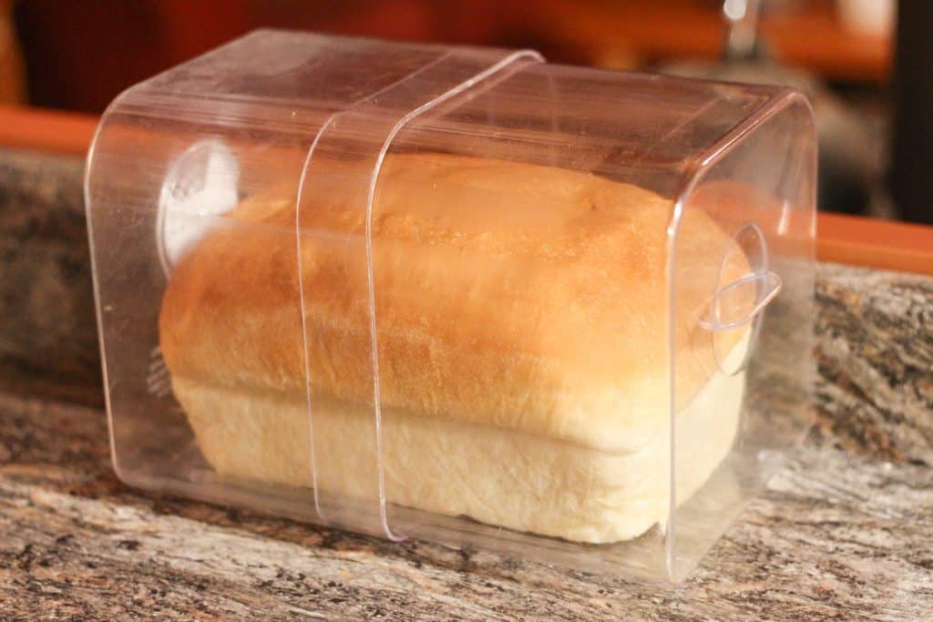 A whole loaf of bread in a bread box-how to store homemade sourdough bread