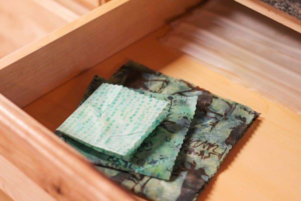 Beeswax wrap folded and stacked in a drawer