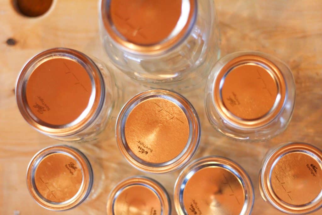 Looking down onto empty canning jars and their lids