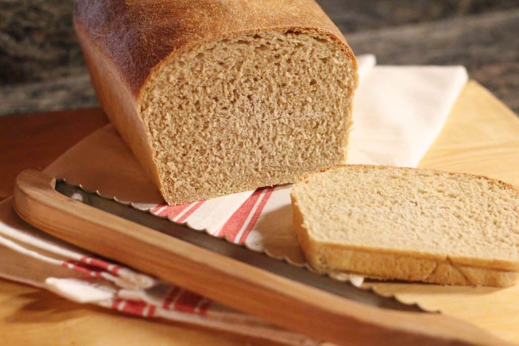 A loaf of whole wheat sourdough sandwich bread sliced