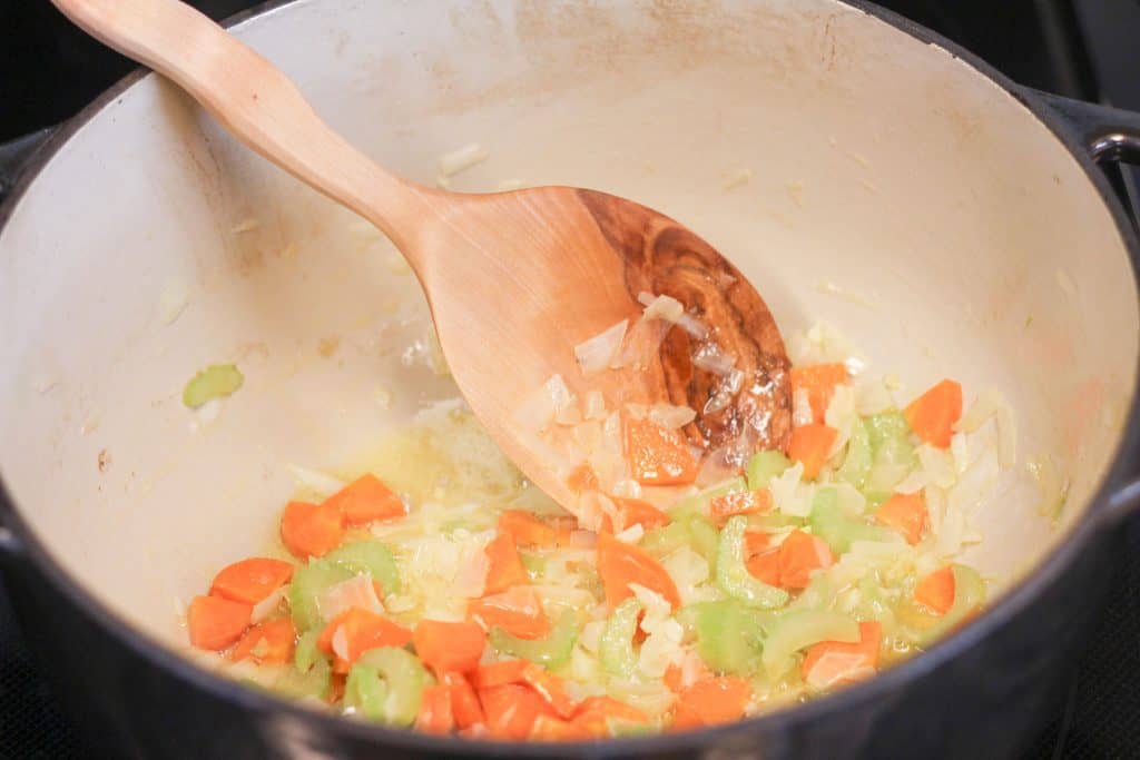 Vegetables cooking in a pot in butter