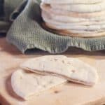 A sourdough pita bread cut in half