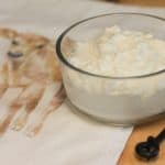 Homemade cream cheese in a glass container