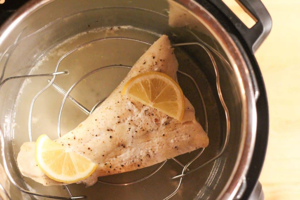 A piece of halibut in an instant pot