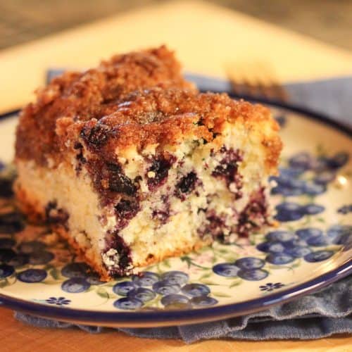 A piece of blueberry coffee cake on a plate